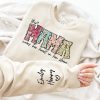 Custom Mama Sweatshirt with Kid Name This Mama Wear Her Heart On Her Sleeve Sweatshirt Personalized Mom Shirt With Names Mothers Day Gift 1