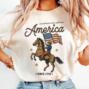 Western America T-Shirt, Cowboy Waving American Flag, Retro Graphic Tee, Land of the Free, Patriotic Vintage 4th of July Shirt